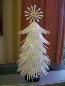 Take a few cotton swabs and fold them crosswise. You will have a snowflake. It can be glued to the top of the tree.